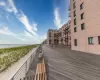 View of community featuring a water view and a view of the beach