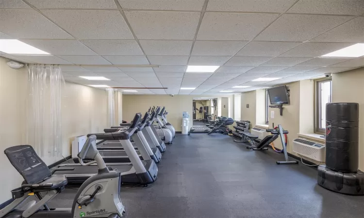 Exercise room featuring a drop ceiling