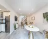 Dining space with light hardwood / wood-style flooring