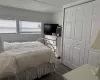 Bedroom featuring vinyl type flooring and a closet