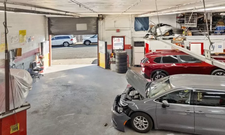 Garage featuring refrigerator