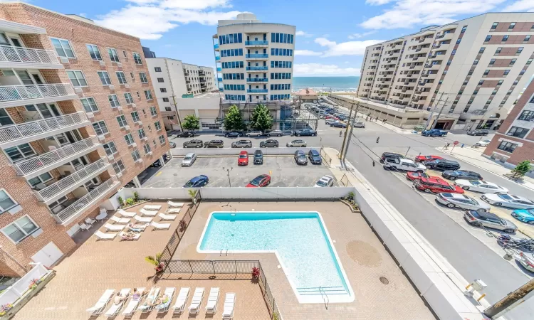 View of pool with a water view