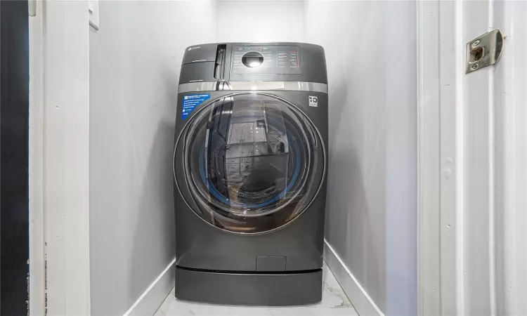 Laundry room featuring washer / dryer