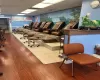 Gym featuring a paneled ceiling and hardwood / wood-style floors