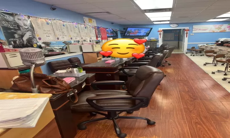 Office featuring a paneled ceiling and hardwood / wood-style flooring