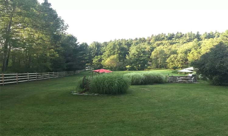 View of yard with split rail fence