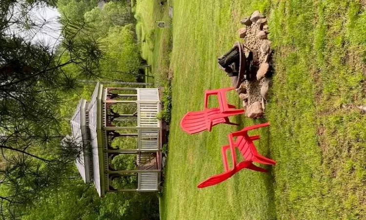 View of yard with a gazebo and an outdoor fire pit