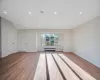 Unfurnished living room featuring radiator and light hardwood / wood-style flooring