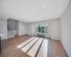 Unfurnished living room featuring light hardwood / wood-style floors and radiator heating unit