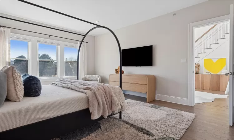 Bedroom with wood-type flooring