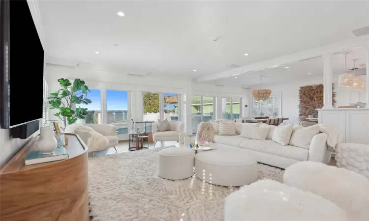 Living room with plenty of natural light and crown molding