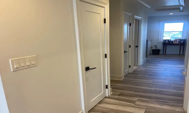 Corridor featuring dark hardwood / wood-style floors