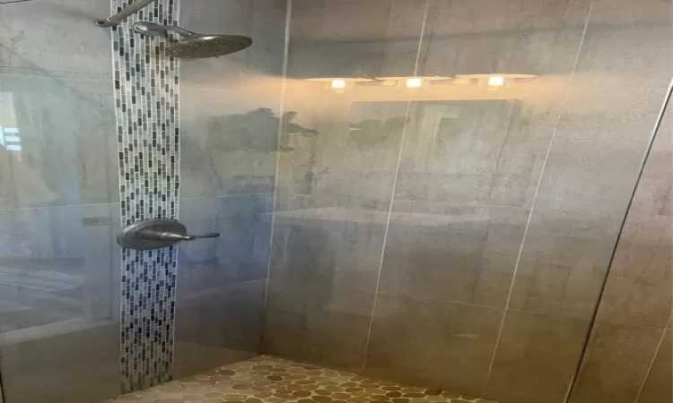 Bathroom featuring a tile shower