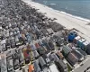 Bird's eye view with a water view and a beach view