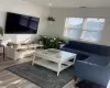 Living room with wood-type flooring