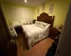 Bedroom with light wood-type flooring and two closets