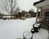 View of yard covered in snow