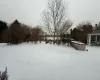 View of yard covered in snow