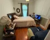 Bedroom featuring wood-type flooring