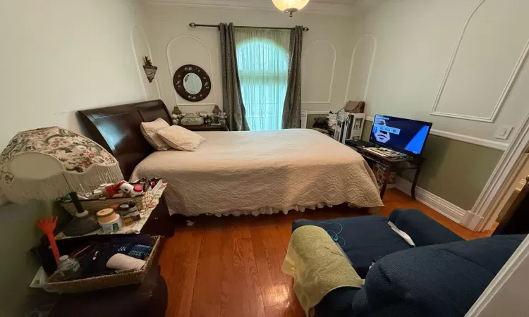 Bedroom featuring wood-type flooring