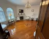 Sitting room featuring light hardwood / wood-style flooring, an inviting chandelier, and crown molding