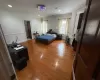 Bedroom featuring ornamental molding and wood-type flooring