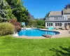 View of pool featuring a fenced in pool, a yard, and a patio