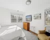 Bedroom with visible vents, baseboards, and wood finished floors