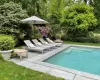 View of swimming pool with a fenced in pool and a patio area