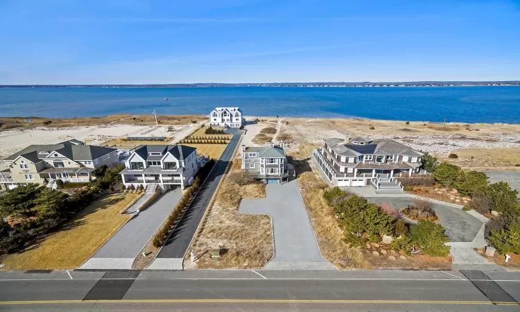 Aerial view featuring a water view and a residential view