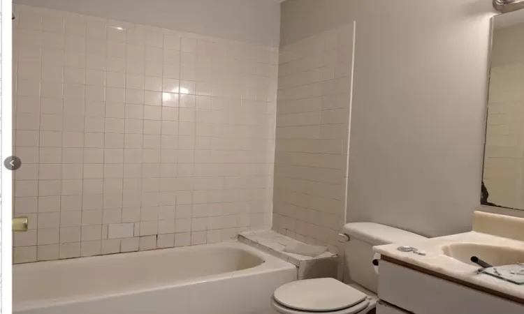 Full bathroom featuring vanity and toilet