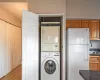 Clothes washing area with stacked washer and dryer,