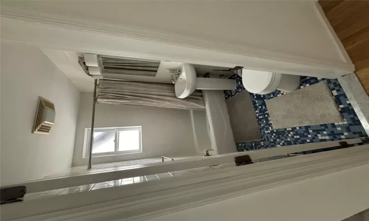 Full bathroom featuring toilet, visible vents, and shower / bath combo with shower curtain