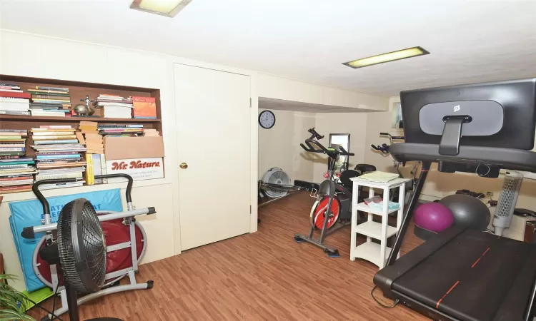 Exercise area featuring wood finished floors