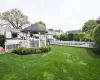 View of yard with a fenced in pool, fence, and a gazebo