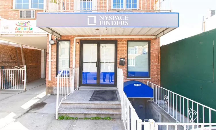 Entrance to property with french doors and brick siding