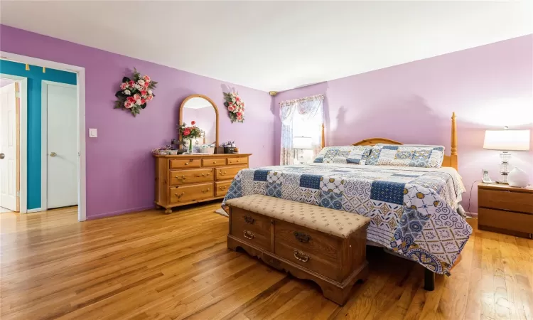 Bedroom featuring baseboards and light wood-style floors