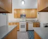 Kitchen featuring sink, washer / clothes dryer, and white appliances