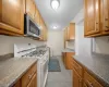 Kitchen featuring white range with gas stovetop