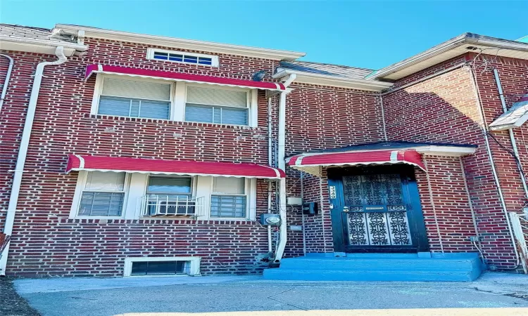 View of front of property featuring brick siding