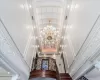 Details featuring an inviting chandelier and crown molding