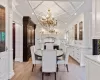 Dining area featuring a chandelier, recessed lighting, light wood-style floors, and ornamental molding