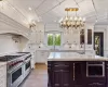 Kitchen with white cabinetry, appliances with stainless steel finishes, and a sink