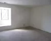 Unfurnished room with carpet and visible vents