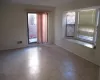 Unfurnished room with visible vents and baseboards