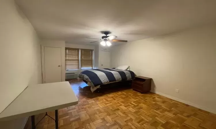 Bedroom featuring baseboards and a ceiling fan