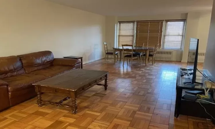 Living area with radiator and baseboards