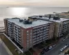 Drone / aerial view with a water view and a view of the beach