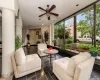 Sunroom featuring ceiling fan