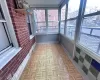 Unfurnished sunroom with plenty of natural light